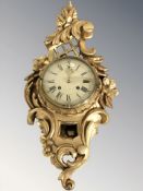 A 20th century continental gilt gesso cartel wall clock, length 60 cm.