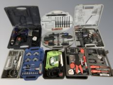 A group of cased tools including drills, screwdriver sets, socket set, etc.