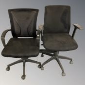Two swivel office armchairs