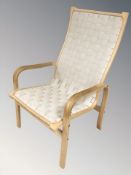 A 20th century Danish bentwood armchair with canvas lattice seat, width 63 cm.