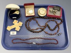 A group of jewellery including crucifix, crystal pendant on chain, brooches,