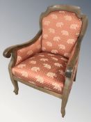 A 20th century continental walnut armchair, width 72 cm.