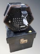 An early 20th century twenty four button concertina,