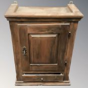 An early 20th century pine single door wall cabinet, width 43 cm.