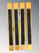Four folding metal trestle stands.
