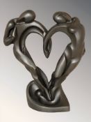 A contemporary metal sculpture of two lovers, height 42 cm.