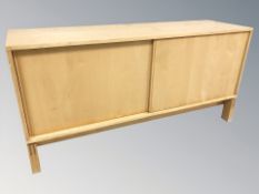 A Scandinavian sliding door low sideboard, 150 cm x 45 cm x 74 cm.