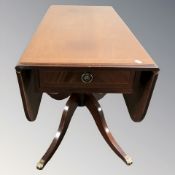 A reproduction inlaid mahogany drop leaf sofa table, length 110 cm.