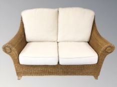 A wicker three piece conservatory suite.