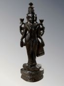 A carved Thai figure of deity,