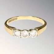 An 18ct gold three-stone diamond ring, size K CONDITION REPORT: 2.