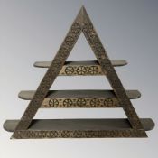 A carved beech triangular wall shelf, width 81 cm.
