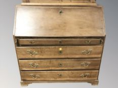 A 19th century oak fall front bureau, 122 cm W x 60 cm D x 120 cm H.