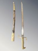 A continental brass mounted dress bayonet in sheath,