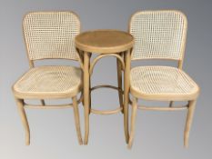 A bentwood occasional table and a pair of caned chairs
