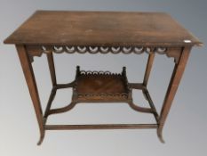 An Edwardian mahogany two tier occasional table,