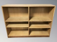 A 20th century oak veneered open bookcase, 120 cm W x 30 cm D x 92 cm H.