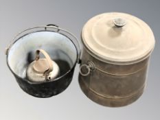 An enameled metal cooking pan, a kettle and a further lidded pot.