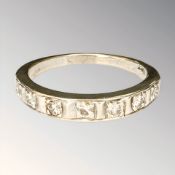 An 18ct gold diamond half-eternity ring, set with seven brilliant-cut stones,