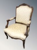 A 20th century continental carved beech salon armchair, width 73 cm.