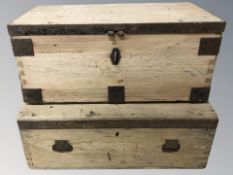 Two metal mounted pine trunks, largest 63 cm wide.