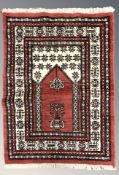 An Iranian prayer rug, 127 cm x 81 cm.