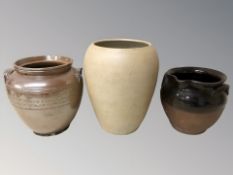 Three various stoneware pots, tallest 28 cm.