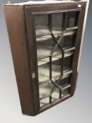 A 19th century glazed corner cabinet,