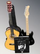A child's Puretone electric guitar, a classical guitar and a volume relating to John Lennon.