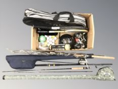 A group of fishing rods, tennis rackets, golf balls, fishing reels,