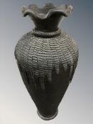 A large terracotta floor standing vase,