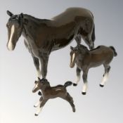 A Beswick brown gloss horse and two foals, horse 20 cm height.