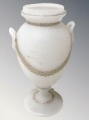 A twin-handled milk glass urn, height 33 cm.