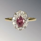 An 18ct gold and platinum ruby and diamond cluster ring, size P½ CONDITION REPORT: 2.