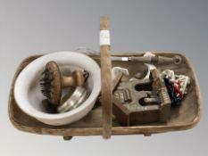 A Sussex trug basket and contents including folk art weather house, whisk, Goss beer bowls, etc.