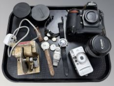 A Nikon D2X camera body, a Canon EF-S 17-85mm lens, two Olympus lens converters,