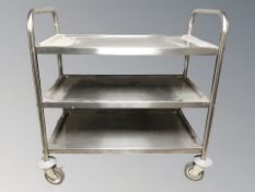A commercial stainless steel catering trolley.