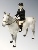 A Beswick huntswoman on dappled grey horse, height 20.