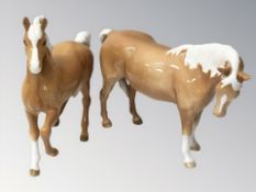 A Beswick prancing Palomino horse, height 18 cm plus another standing.
