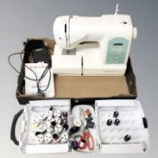 A Singer Starlet electric sewing machine with lead and pedal,
