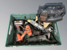 An assortment of power tools including drills, nail gun, etc.