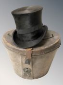 A gent's black silk top hat by A N Wilkinson, Lincoln, in leather case.