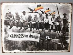 A reproduction Guinness sign, 70 cm x 50 cm.