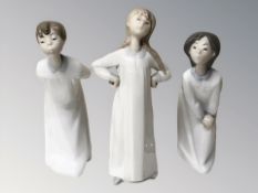 Three Lladro figures of children in night dress, tallest 20.