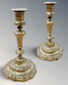 A pair of French ormolu candlesticks, 19th century, one with impressed mark CO to base, height 23cm.