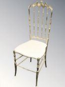 A brass occasional chair