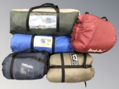 A group of camping equipment including four person tent with porch, three person tent, etc.
