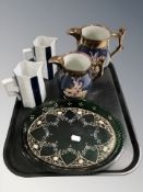 Two graduated copper lustre jugs,