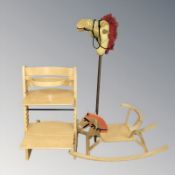 A child's beech high chair, rocking horse and a hobby horse.
