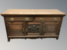 An Arts & Crafts oak sideboard,